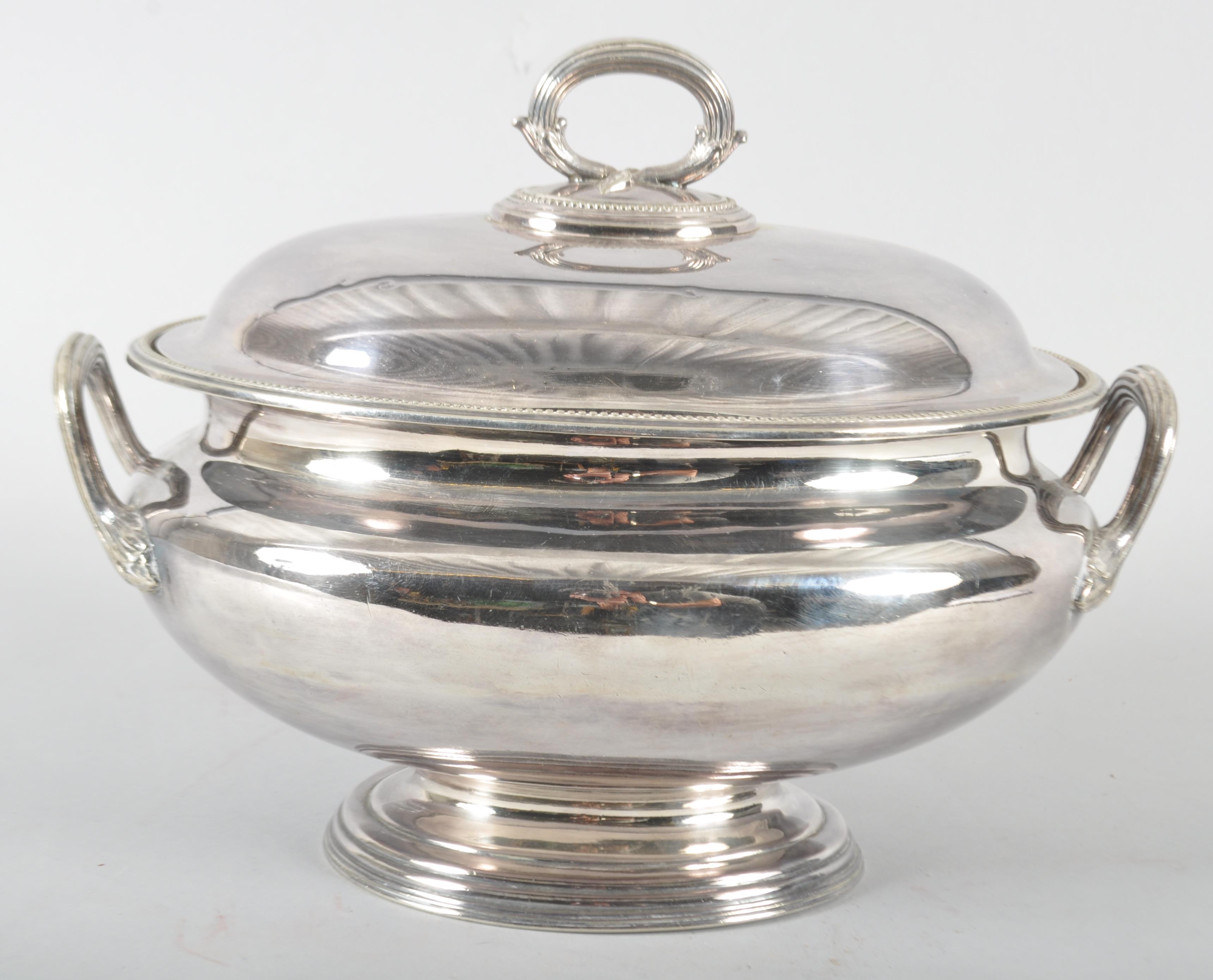 A Victorian silver plated soup tureen, raised on spreading foot with leaf capped twin handles,