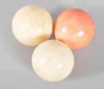 Three antique ivory billiard balls, late 19th/early 20th century,