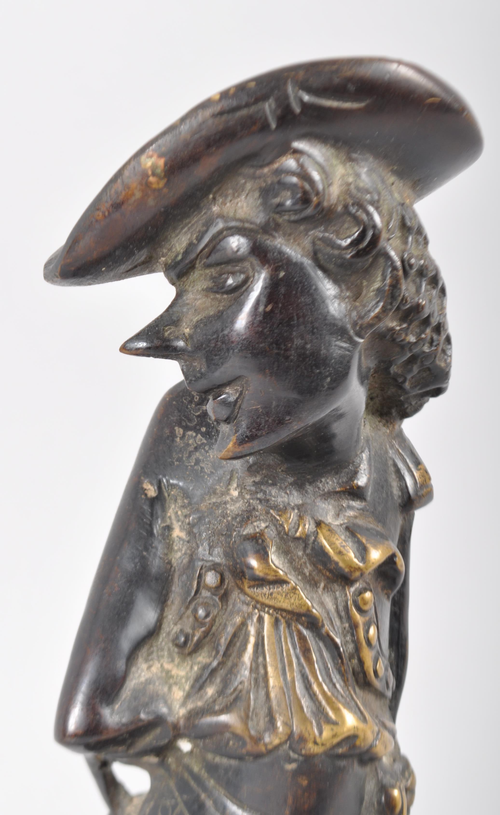 A Continental gilt bronze figural candlestick, modelled as a man, perhaps a matador, - Image 2 of 2