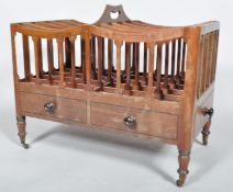 A late Regency 19th century mahogany double canterbury having ten sectional top with handle,
