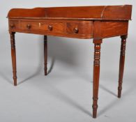 A 19th century mahogany wash stand with shaped front,