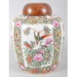 A Canton porcelain Famille Rose oviform vase and a bird's maple domed cover,