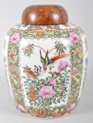 A Canton porcelain Famille Rose oviform vase and a bird's maple domed cover,