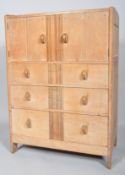 An Art Deco limed oak cupboard-chest,