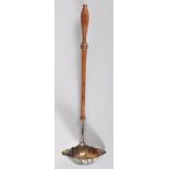 A silver punch or toddy ladle, with shaped oval double lipped bowl, set on a turned mahogany handle,