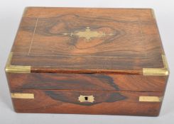 A Victorian rosewood brass mounted jewellery box,