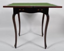 A 19th Century Victorian mahogany envelope card table table having a four piece hinged top