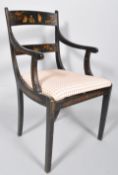 A regency-style japanned armchair,