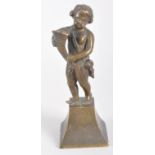 A bronze sculpture of a putto holding a conucopia, on a waisted plinth base,
