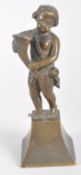 A bronze sculpture of a putto holding a conucopia, on a waisted plinth base,