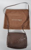 A Bottega Veneta ladies dark brown leather handbag, with intrecciato weave,