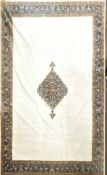 A large wool carpet, with a central foliate lozenge on a cream field,