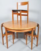 G-Plan, a 1960's retro vintage teak wood round table with a set of four 1960's wedge chairs,