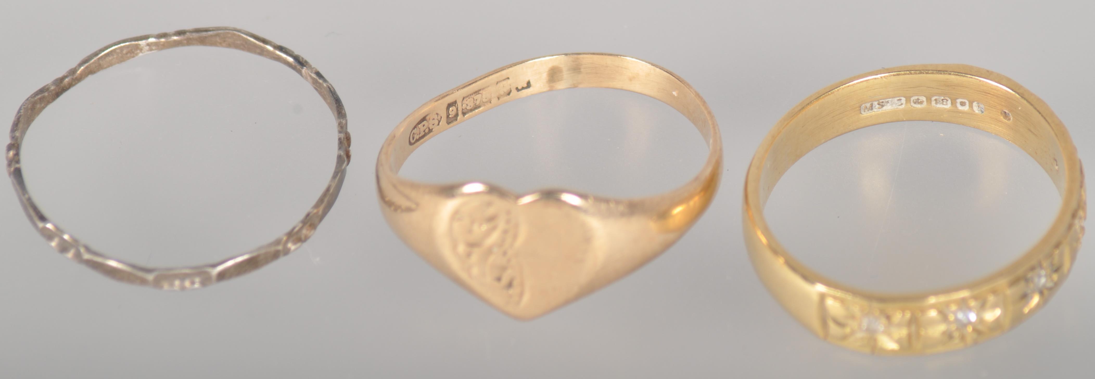 A collection of three rings to include: A 9ct gold heart shaped signet ring; - Image 2 of 3