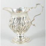 A small silver cream jug, in the 18th century style,