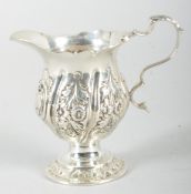 A small silver cream jug, in the 18th century style,