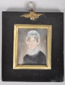19th century School, a portrait miniature of an elderly lady in lace bonnet and ruff,