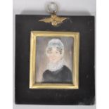 19th century School, a portrait miniature of an elderly lady in lace bonnet and ruff,