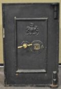 A Victorian wrought iron safe, stamped with the Royal Arms, the interior painted blue,
