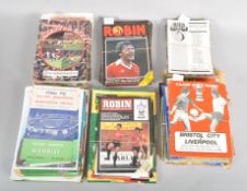 A group of football programmes including The Robin, Bristol City, Manchester United,