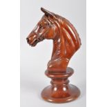 A carved hardwood bust of a horse in the form of a outsized chess piece knight