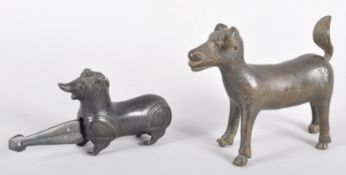 Two 19th Century Indian brass Dokrah stylized figures to include a cow and a miniature dog,