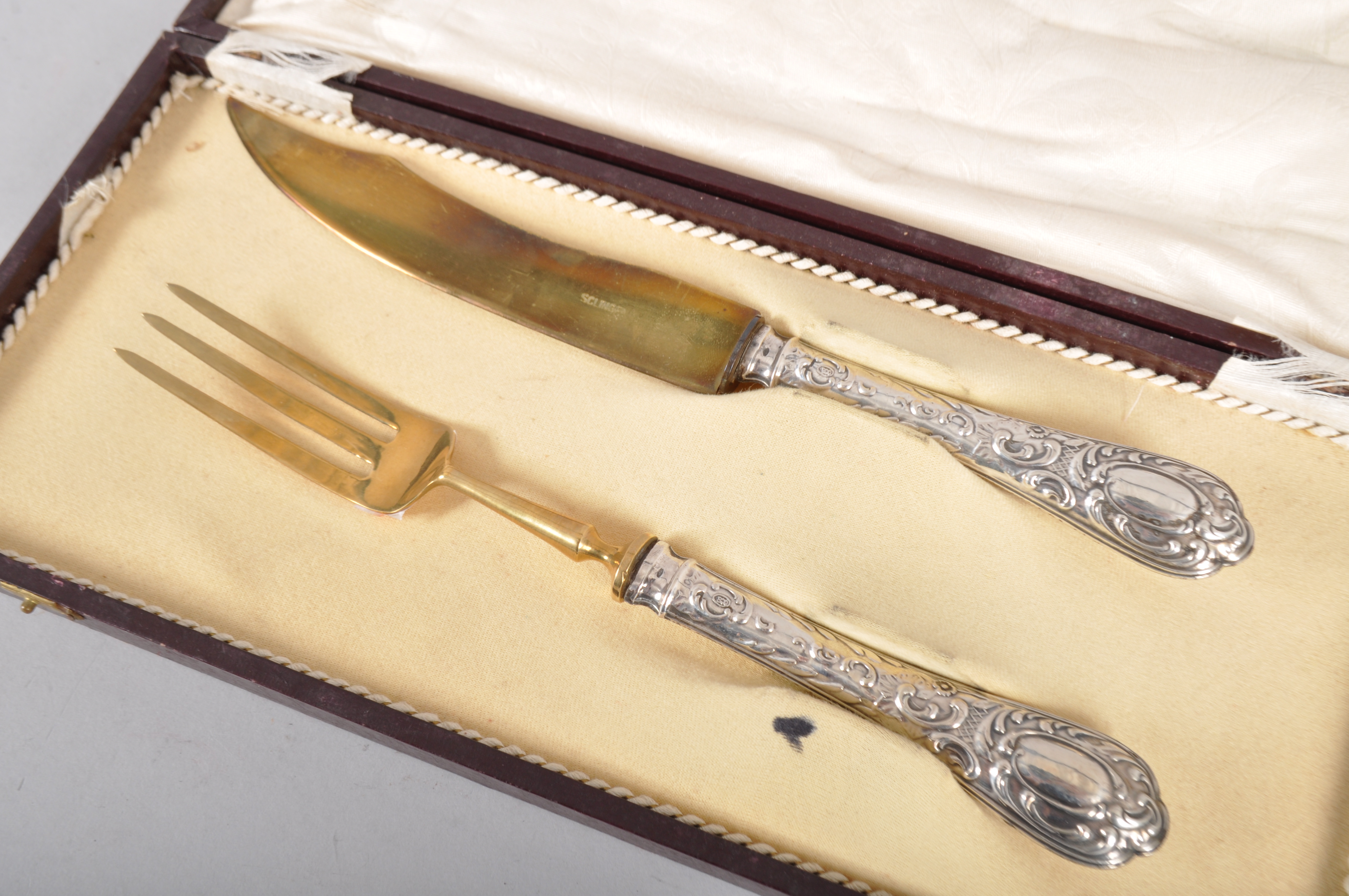 A Solingen gilded serving knife and fork, with embossed white metal handle, - Image 4 of 4