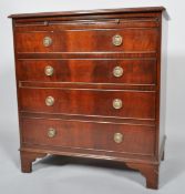 A 20th century George III style mahogany chest of four graduated cock beaded drawers,