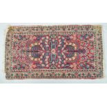 A Middle Eastern small scale carpet claret centre ground,