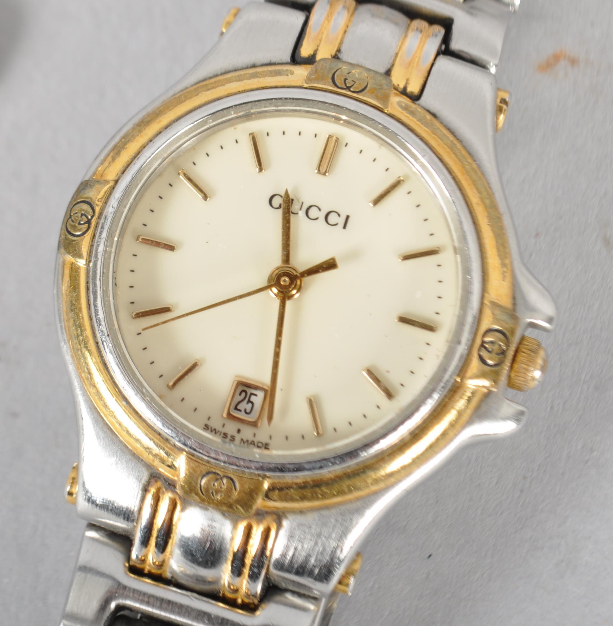 A mixed metal Gucci quartz wristwatch. Circular cream dial with baton markings and date feature. - Image 2 of 2