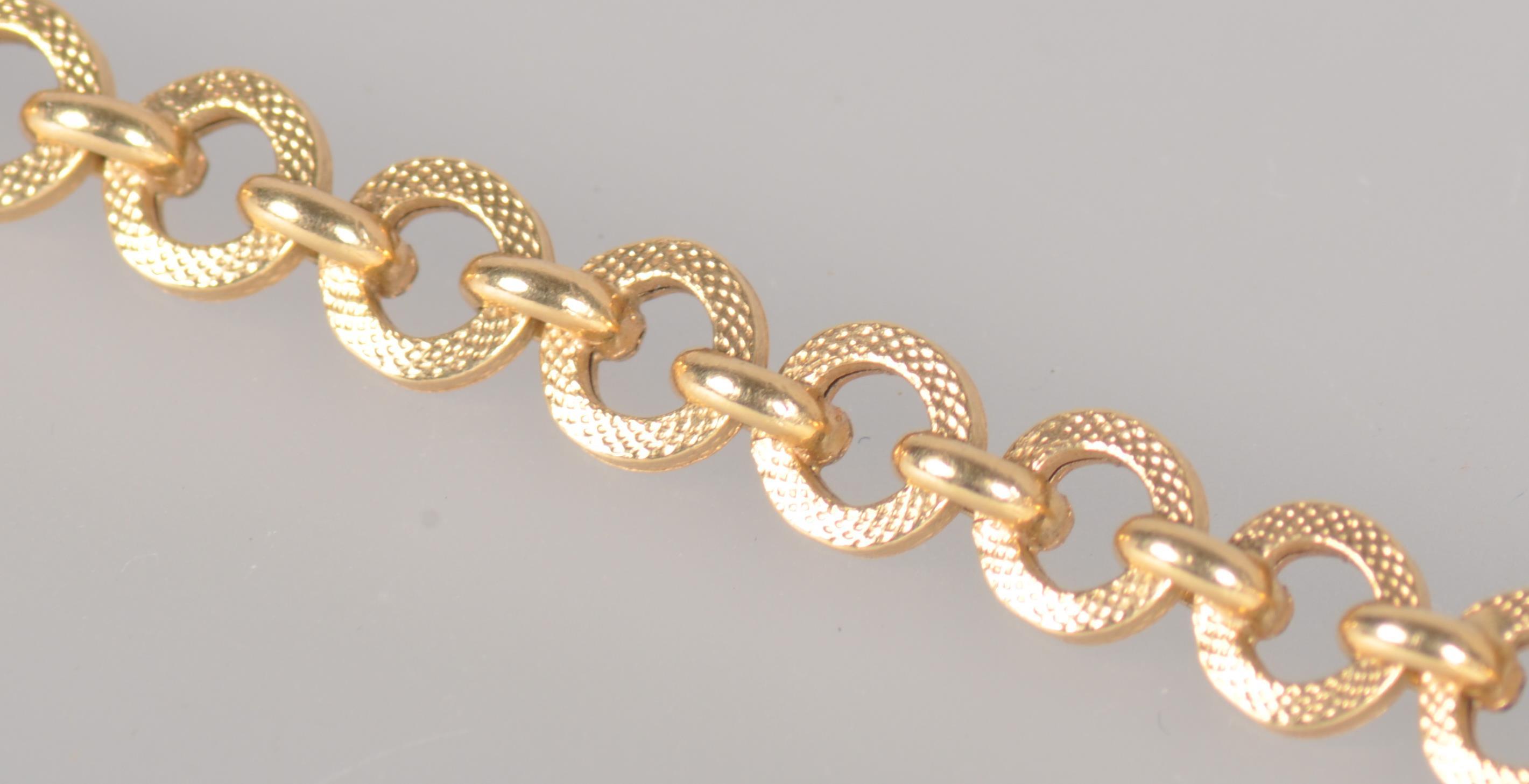 A yellow metal linked bracelet, 6 ½ inch length, bolt ring clasp. - Image 2 of 3