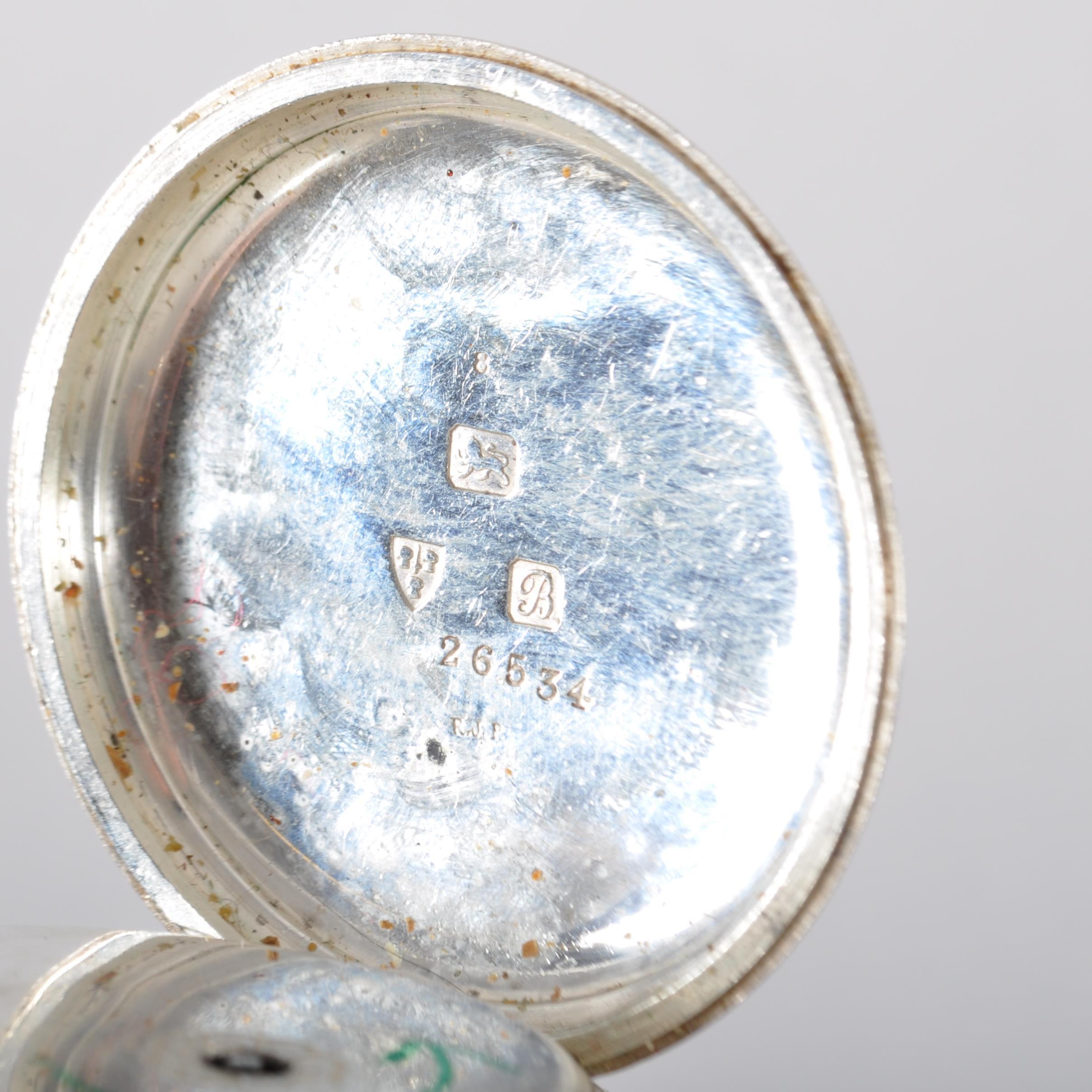 A sterling silver open face key wound pocket watch. - Image 4 of 4