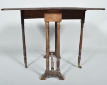 An Edwardian mahogany and inlay Sutherland table having a drop leaf and bevelled edge top