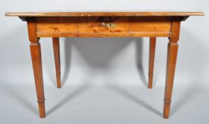 A French elm rectangular farmhouse table, with single drawer and plank top, on square tapering legs,