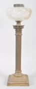 An Edwardian column lamp, with gilt metal Corinthian column base issuing cut glass shade,