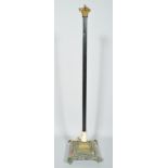An Edwardian brass standard lamp, the fluted stem with gilt Corinthian capital,