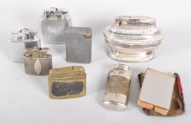 A collection of eight vintage cigarette lighters, including Ronson Viking, Standard, Domo,
