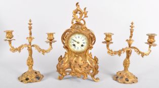 A French gilt metal neo rococo clock garniture, late 19th century,