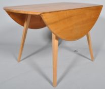 Lucian Ercolani - Ercol - 384 - A 1960's retro vintage beech and elm round drop leaf dining table