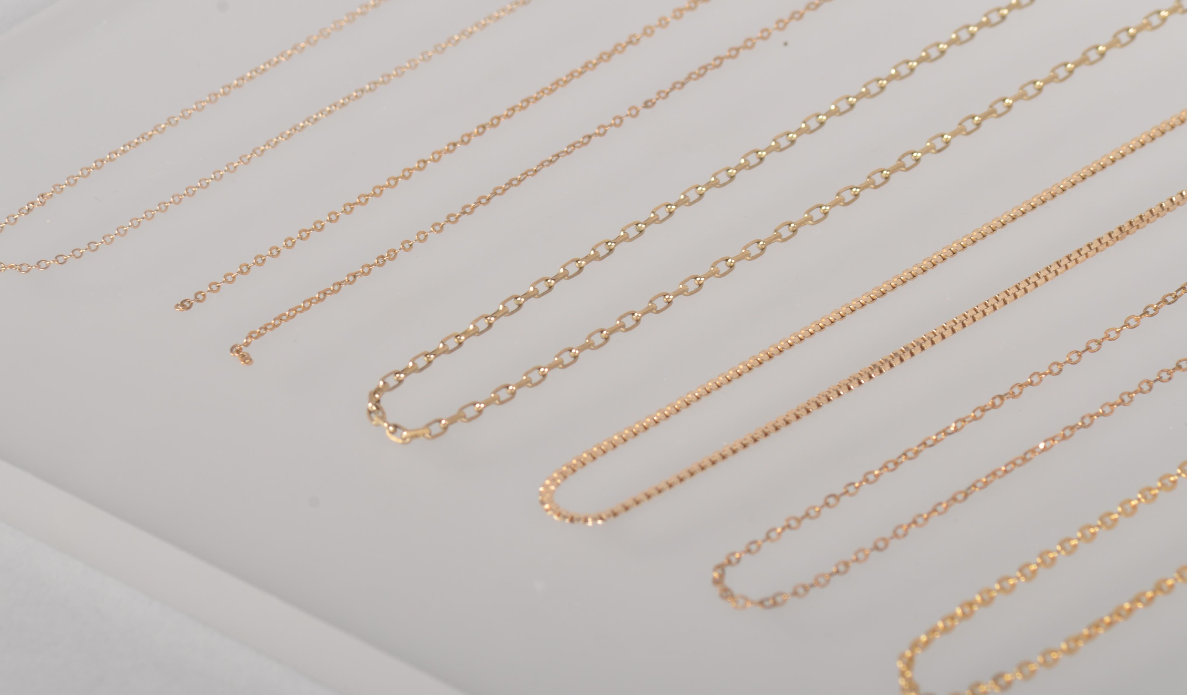 A collection of six yellow metal linked necklace chains. - Image 2 of 3