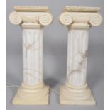A pair of composite simulated albaster and resin corinthian column jardiniere stands, 20th century,