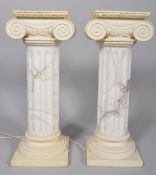 A pair of composite simulated albaster and resin corinthian column jardiniere stands, 20th century,