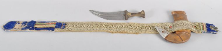 An Omani Khanjar dagger with 20cm blade and horn handle with steel details,