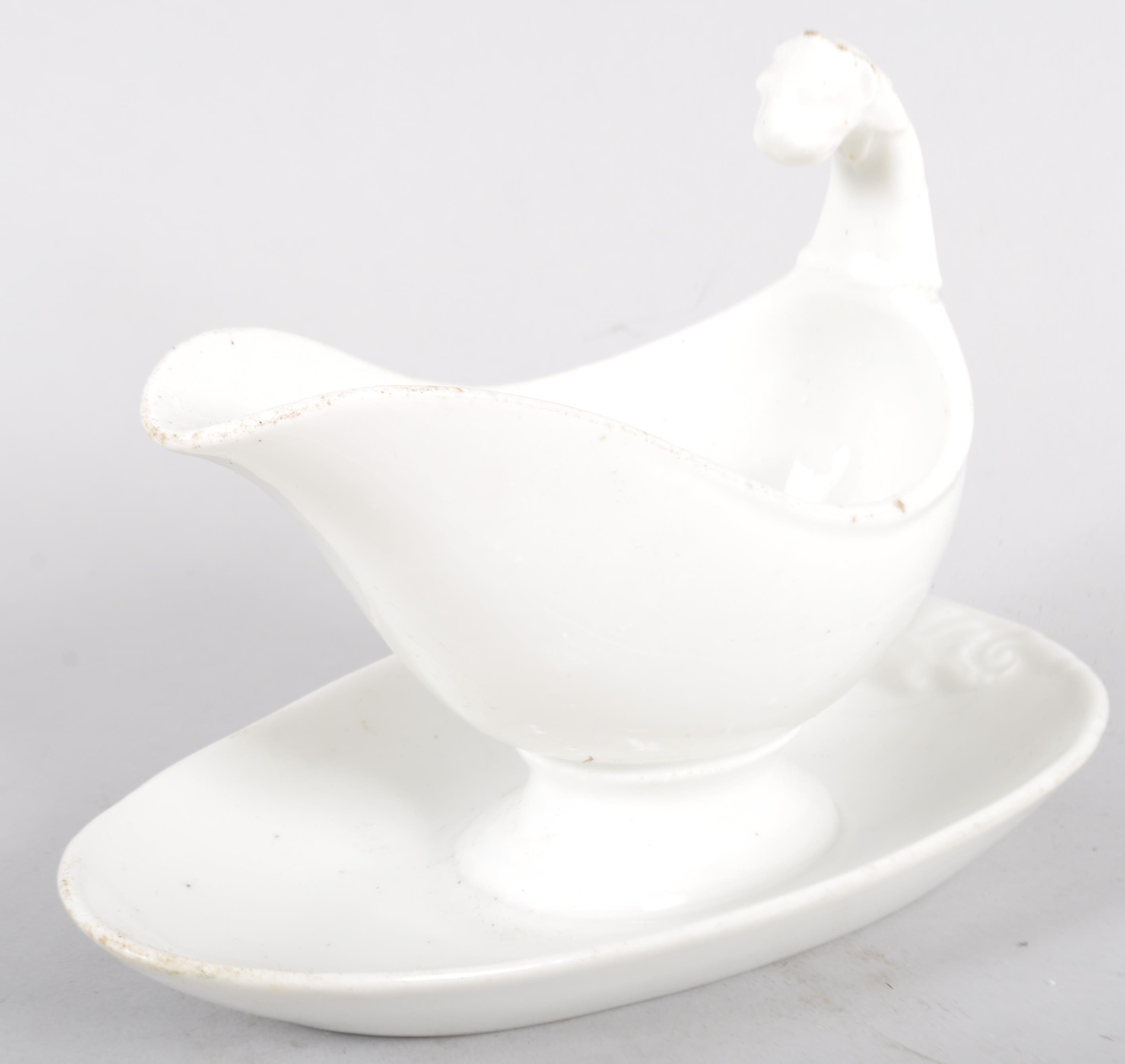 A Continental porcelain white sauce boat and stand, with lion terminal, - Image 2 of 2