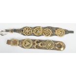 A pair of brass horse straps with pierced and cast decoration on leather lapets largest 64cm