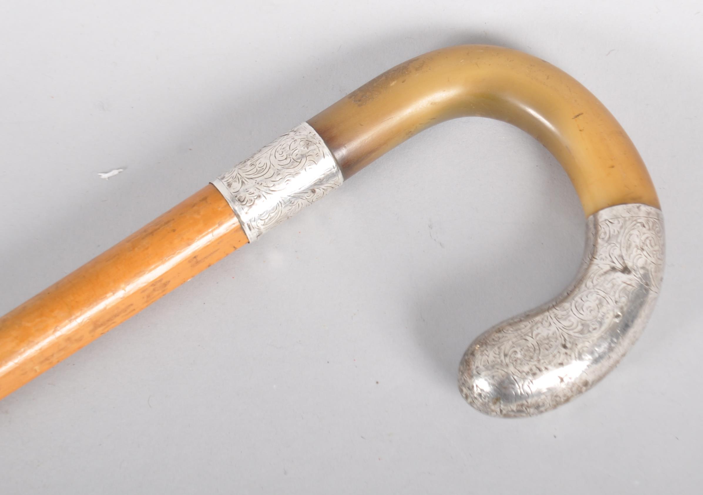 A horn mounted walking stick, with engraved silver coloured handle and collar, initalled AC, - Image 2 of 2