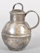 A novelty white metal cigarette lighter, formed as a jug and cover,