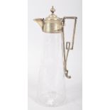 A silver plated engraved glass claret jug, circa 1890, the plated mounted engraved with laurel,