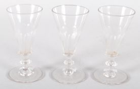 Three 19th century faceted drinking glasses 13 cm.