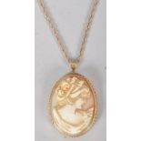 A 9ct gold cameo pendant, carved in relief with a lady, the mount stamped Birmingham 1975,